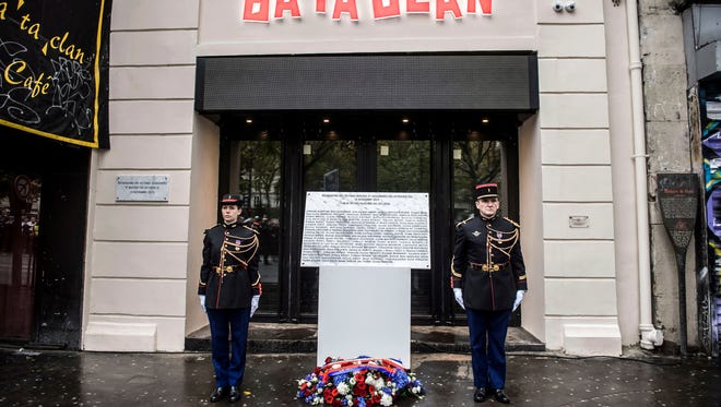 A commemorative plaque unveiled by French President Francois Hollande and Paris Mayor Anne Hidalgo is seen in front of the Bataclan concert hall in Paris.