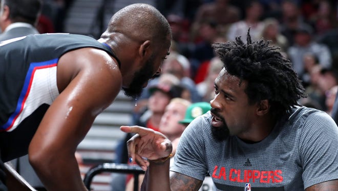 Chris Paul and DeAndre Jordan have a verbal exchange on the sidelines.