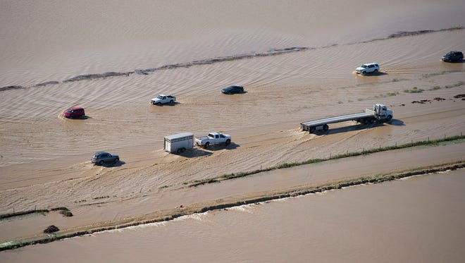 Flood water crosses over Interstate 5 on Feb. 18, 2017 in Williams, Calif.