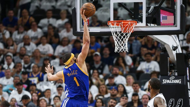 Golden State Warriors center JaVale McGee (1) scores a basket during the first quarter against the San Antonio Spurs in game three of the Western conference finals of the NBA Playoffs at AT&T Center.