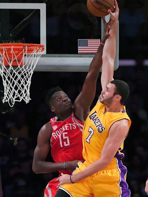 Larry Nance Jr. goes up for a dunk over Clint Capela.