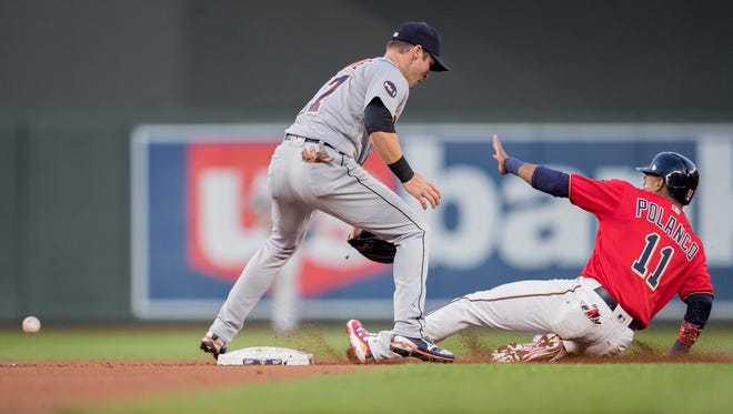 Twins shortstop Jorge Polanco (11) steals second base as the ball roles past Tigers shortstop Andrew Romine (17) in the second inning Friday in Minneapolis.