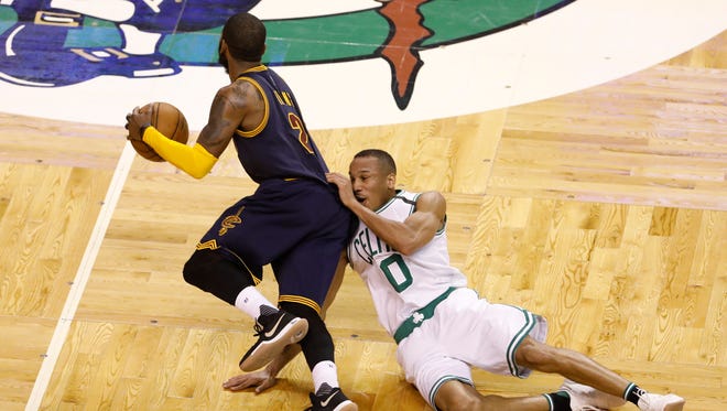 Boston Celtics guard Avery Bradley (0) dives for the ball against Cleveland Cavaliers guard Kyrie Irving (2) during the second quarter in Game 2 of the Eastern Conference finals.