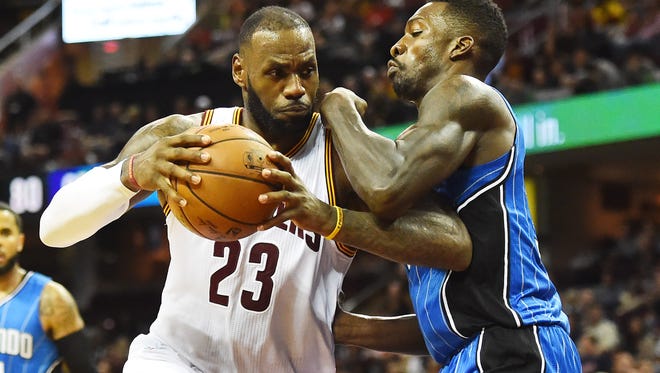 Cleveland Cavaliers forward LeBron James (23) controls the ball as Orlando Magic forward Jeff Green (34) defends during the second half at Quicken Loans Arena. The Cavaliers won 105-99.
