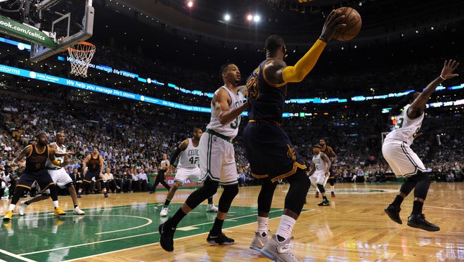 Cleveland Cavaliers forward LeBron James (23) controls the ball from Boston Celtics forward Gerald Green (30) during the second half in game one of the Eastern conference finals of the NBA Playoffs at TD Garden.