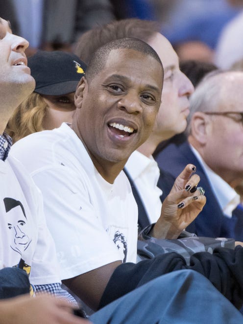 Jay-Z and wife Beyonce watch the Warriors-Spurs game.