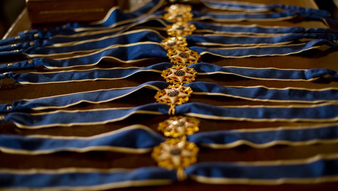 Presidential Medals of Freedom are seen on a table prior to the start of the ceremony.