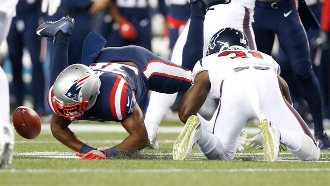 Houston Texans returner Charles James (31) fumbles the ball during the first quarter against the New England Patriots at Gillette Stadium.