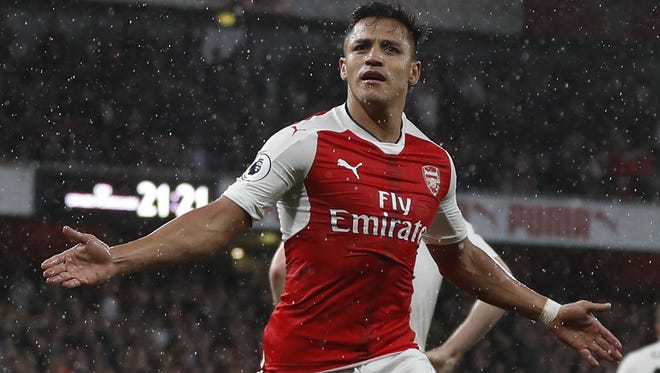 Arsenal striker Alexis Sanchez celebrates scoring the second goal during the English Premier League football match between Arsenal and Sunderland.