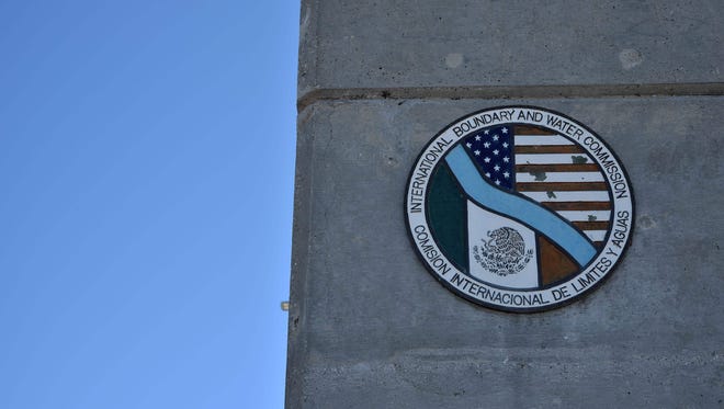 A shield with the flags of the United States and Mexico is seen on the international boundary at Amistad Reservoir on the U.S./Mexico border near Ciudad Acuna, Mexico on Feb. 21, 2017.