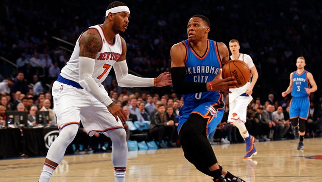 Oklahoma City Thunder guard Russell Westbrook (0) drives to the basket past New York Knicks forward Carmelo Anthony (7) during the first quarter at Madison Square Garden.