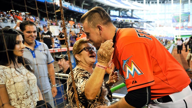 Fernandez (right) hugs his grandmother Olga Fernandez (left). Fernandez, a Cuban-born pitcher, was drafted 11th overall in 2011 and grew up in Miami.
