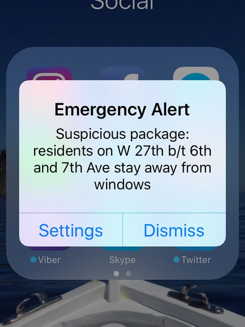 An Emergency Alert appears on a mobile phone concerning a suspicious package on West 27th Street between 6th and 7th Avenues, early Sunday morning, Sept. 18, 2016, in New York.