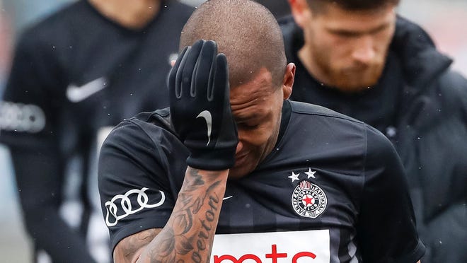 Partizan Belgrade's Brazilian midfielder Everton Luiz leaves the field in tears on February 19, 2017, at the end of a Serbian championship match between Partizan and Rad, after racist remarks from Rad's supporters, Serbian television B92 reported.
Every time he touched the ball, 28-year-old Everton Luiz was being monkey-screamed from a group of supporters of Rad Belgrade, the source said. Shortly before the end, the match was briefly interrupted when Rad supporters also waved a banner with an insulting message against the Brazilian.  / AFP PHOTO / STRSTR/AFP/Getty Images ORIG FILE ID: AFP_LV046