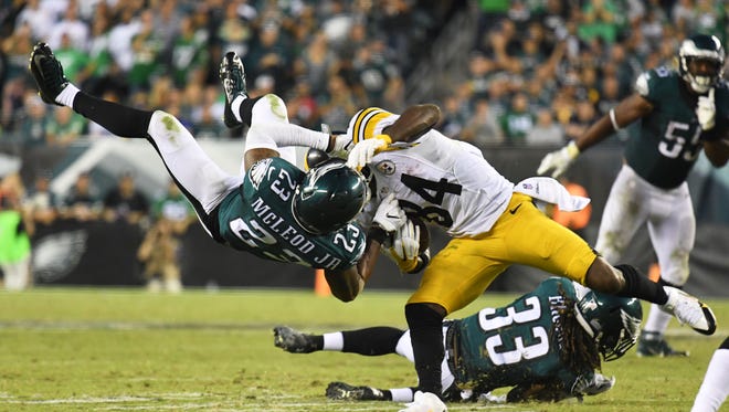 Eagles free safety Rodney McLeod (23) attempts to tackle Steelers wide receiver Antonio Brown (84).