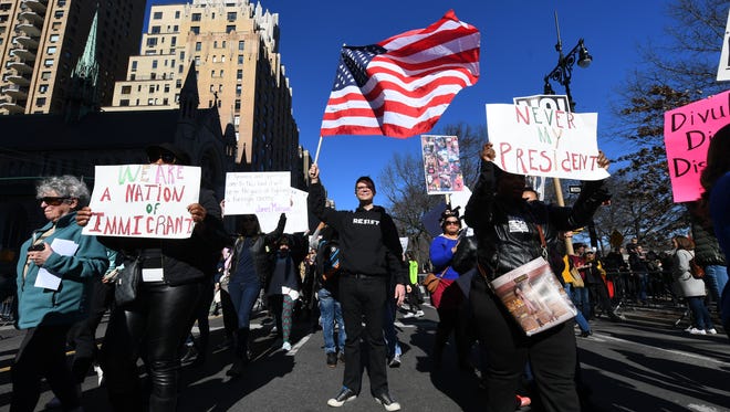 Protestors march along Central Park South during the 'Not My Presidents Day' rally in New York City on Feb. 21, 2017.