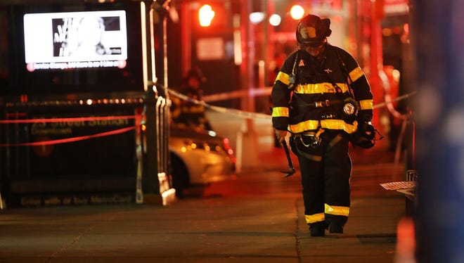 Police, firefighters and emergency workers gather Saturday night at the scene of an explosion in Manhattan's Chelsea section.