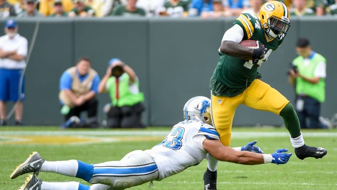 Packers running back James Starks (44) tries to elude Lions defender Kyle Van Noy (53) on a second-half carry.