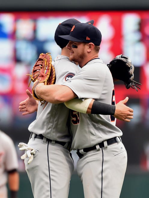 Tigers third baseman Nick Castellanos, left, and first baseman John Hicks congratulate each other after the Tigers beat the Twins, 13-4, Sunday, April 23, 2017 in Minneapolis.