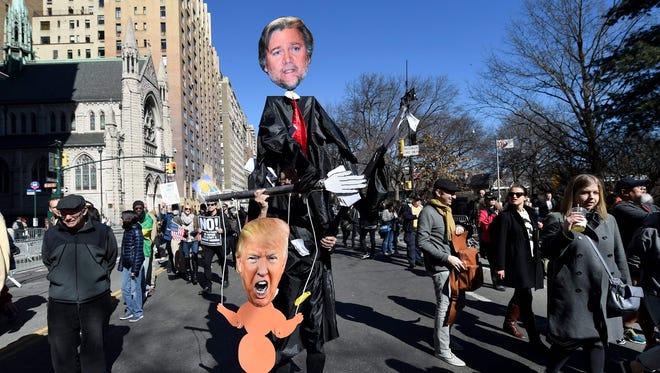 Protestors march down Central Park West in New York City during a 'Not My President's Day' rally on Feb. 20, 2017.