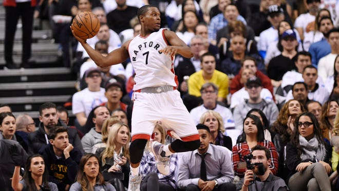 Kyle Lowry keeps the ball from going out of bounds.