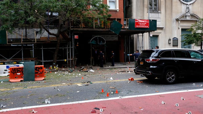 Police investigate at the site of an explosion that occurred Saturday night  in the Chelsea neighborhood of New York City.