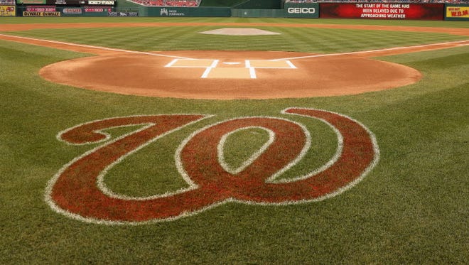 The field is shown during a weather delay between the Washington Nationals and Atlanta Braves at Nationals Park.
