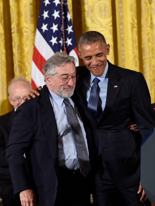 US President Barack Obama presents actor Robert DeNiro with the Presidential Medal of Freedom.