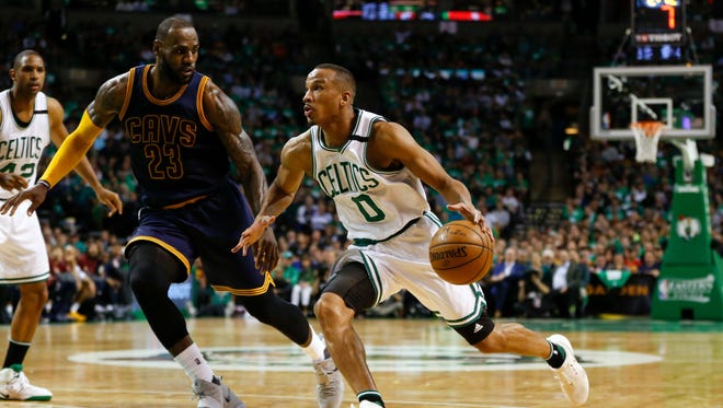 Avery Bradley dribbles the ball around LeBron James during the second quarter of Game 5 of the Eastern Conference finals.