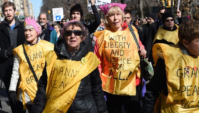 Protestors march down Central Park West in New York during a 'Not My President's Day' rally on Feb. 20, 2017 as part of a weekend of protest against President Trump.