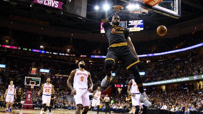 LeBron James dunks in the first half against the Knicks.