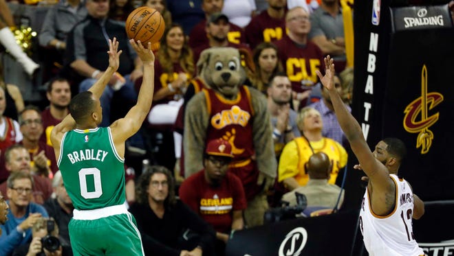 Boston Celtics guard Avery Bradley (0) shoots over Cleveland Cavaliers center Tristan Thompson (13) in the second half in Game 3 of the Eastern Conference finals.