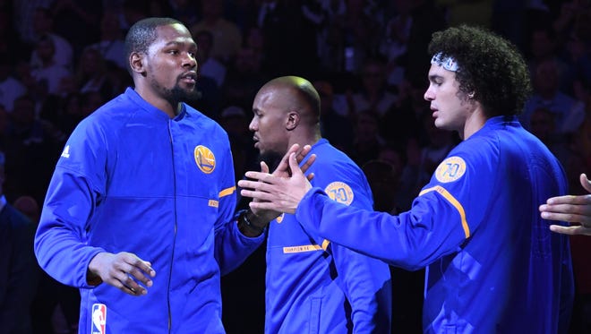 Kevin Durant high fives Anderson Varejao before the opening night game against the San Antonio Spurs.