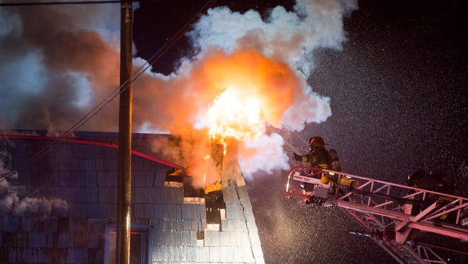 Firefighters work to extinguish the fire. The 16-lane alley, at 1430 Whiterock Ave., has been family owned and operated since 1933, according to the business' website.
No details on the fire were immediately available Sunday night.