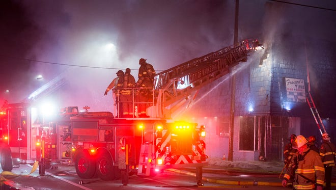 Firefighters work to extinguish a fire that struck the historic Fracaro's Lanes in Waukesha Sunday night, according to a Waukesha police dispatcher.
