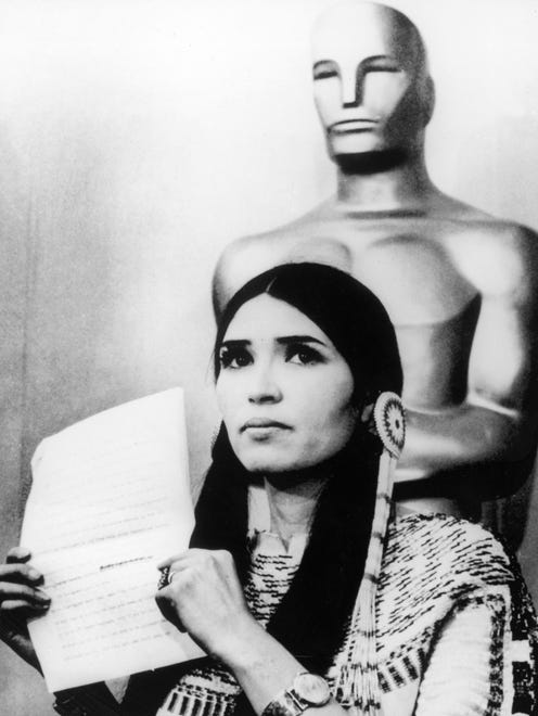 1973: Instead of accepting his Oscar best actor statue for " The Godfather, " Marlon Brando sent Native American activist Sacheen Littlefeather to protest the misrepresentation of American Indians in Hollywood.