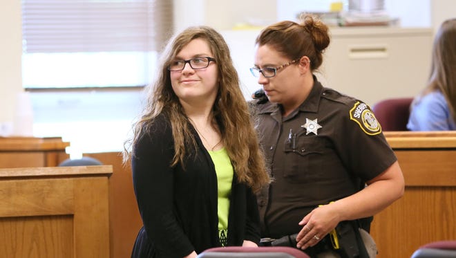 Anissa Weier looks in the direction of her family and smiles as she is led into a Waukesha County Circuit courtroom on July 10 for a hearing. Monday. She is one of two girls charged as adults in 2014 stabbing of their sixth-grade classmate, who survived 19 stab wounds. The girls told police they committed the crime to impress or appease Slender Man, a fictional internet character. Weier on Monday pleaded guilty to a reduced charge and will proceed to trial only on whether her mental condition at the time should make her legally responsible for the crime.