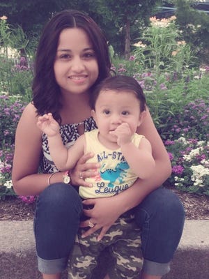 Riccy Enriquez Perdomo, 22, of Florence, Kentucky, with her son, Rony, 11 months, has been detained by federal immigration police even though she has legal status, her family members and attorneys say.