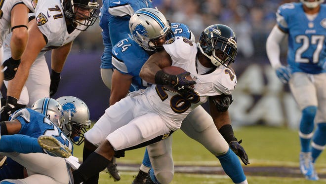 Lions linebacker DeAndre Levy tackles Ravens RB Terrance West in a 2016 exhibition game.