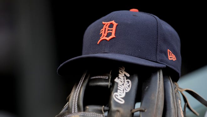 A detailed view of a Tigers hat sitting on top of a glove in the dugout before a game Friday in Minneapolis.