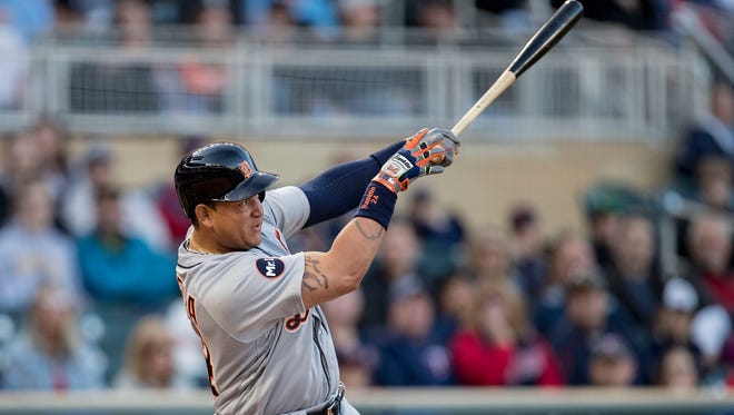Tigers first baseman Miguel Cabrera (24) hits a single in the first inning Friday in Minneapolis.
