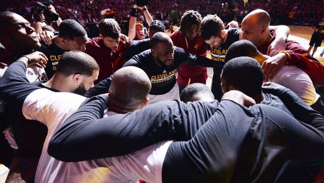 Cleveland Cavaliers forward LeBron James (23) talks to the team before Game 4 of the Eastern Conference finals.