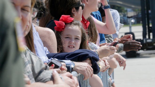 A young  supporters waits with others for President Donald Trump at the 128th Air Refueling Wing at 1919 E Grange Avenue near General Mitchell International Airport in Milwaukee, on Tuesday, June 13, 2017. President Donald Trump returned Tuesday afternoon to the Milwaukee-area where he was expected to talk about health care, tout job apprenticeships and raise cash for Gov. Scott Walker.