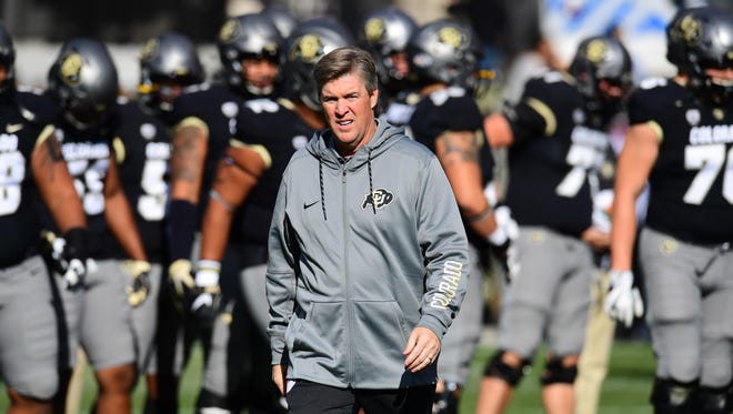 Colorado coach Mike MacIntyre with his team before their game against Washington State.