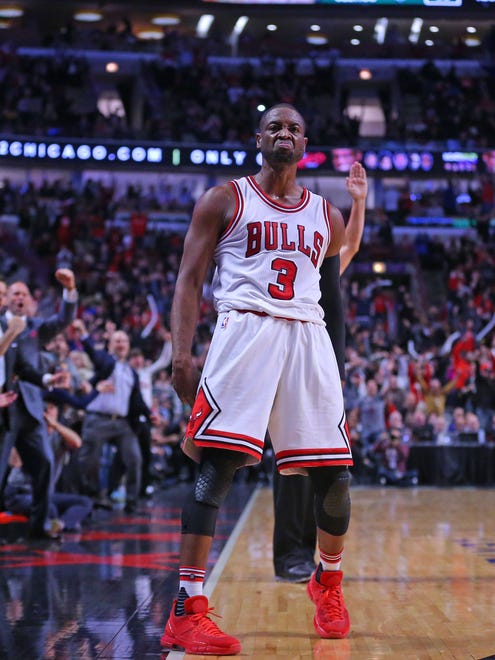 Dwyane Wade celebrates after hitting a late three in his Bulls debut.