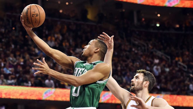 Boston Celtics guard Avery Bradley (0) drives to the basket against Cleveland Cavaliers forward Kevin Love (0) during the first quarter in Game 4 of the Eastern Conference finals.