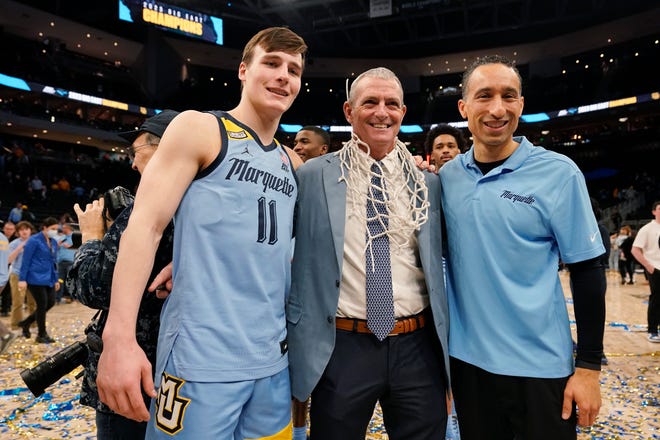MILWAUKEE, WISCONSIN - MARCH 04: (L-R) Tyler Kolek #11 of the Marquette Golden Eagles, Marquette University president Dr. Michael Lovell, and head coach Shaka Smart pose for a photo during a celebration after a game against the St. John's Red Storm at Fiserv Forum on March 04, 2023 in Milwaukee, Wisconsin. (Photo by Patrick McDermott/Getty Images)