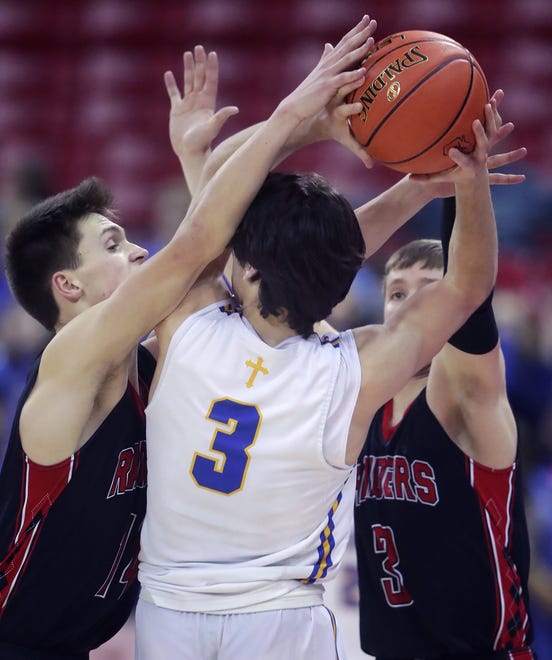 Marathon High School's Tyler Underwood (14) and Cooper Hoeksema (3), right, against Kenosha St. Joseph Catholic Academy's Eric Kenesie (3) in a Division 4 semifinal game during the WIAA state boys basketball tournament on Thursday, March 14, 2024 at the Kohl Center in Madison, Wis. Kenosha St. Joseph Catholic defeated Marathon 46-37.
Wm. Glasheen USA TODAY NETWORK-Wisconsin