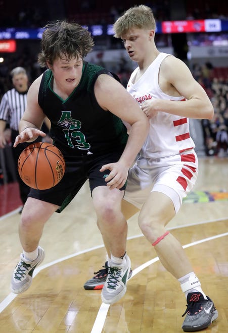 Almond-Bancroft High School's Emmitt Stiles (13) against Abundant Life Christian School's Blayne Wall (21) in a Division 5 semifinal game during the WIAA state boys basketball tournament on Friday, March 15, 2024 at the Kohl Center in Madison, Wis. Abundant Life defeated Almond-Bancroft 42-37.
Wm. Glasheen USA TODAY NETWORK-Wisconsin