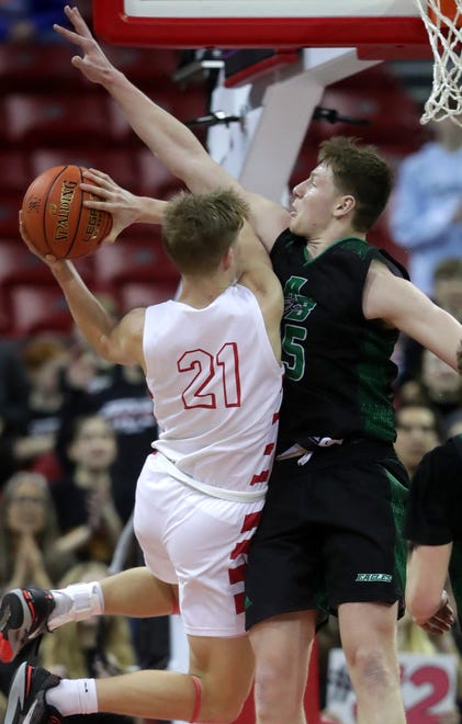 Abundant Life Christian School's Blayne Wall (21) against Almond-Bancroft High School's Ayden Phillips (15) in a Division 5 semifinal game during the WIAA state boys basketball tournament on Friday, March 15, 2024 at the Kohl Center in Madison, Wis. Abundant Life defeated Almond-Bancroft 42-37.
Wm. Glasheen USA TODAY NETWORK-Wisconsin